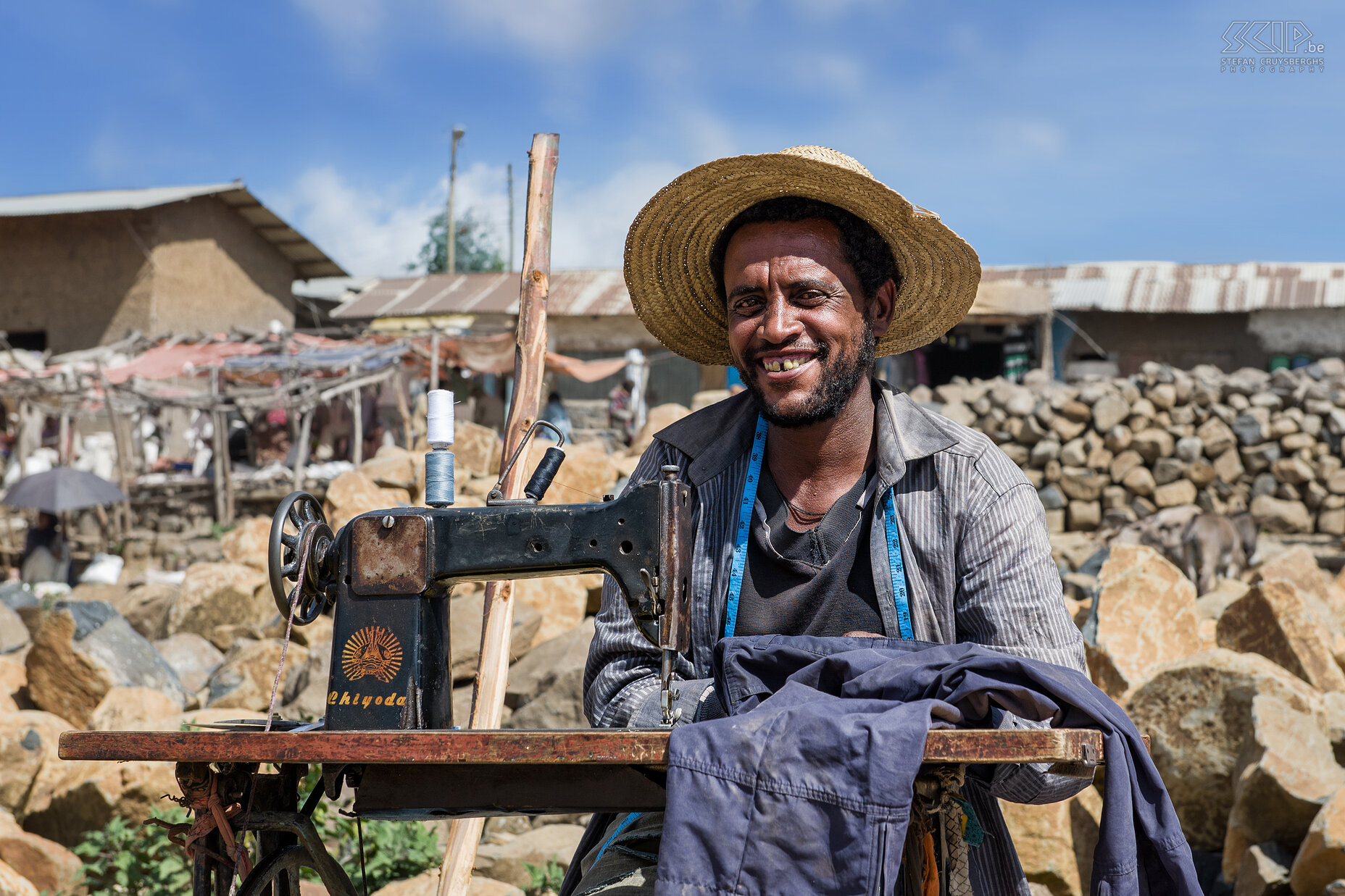 Debark - Man behind sewing machine A friendly man behind his sewing machine on the local market in the village of Debark. Stefan Cruysberghs